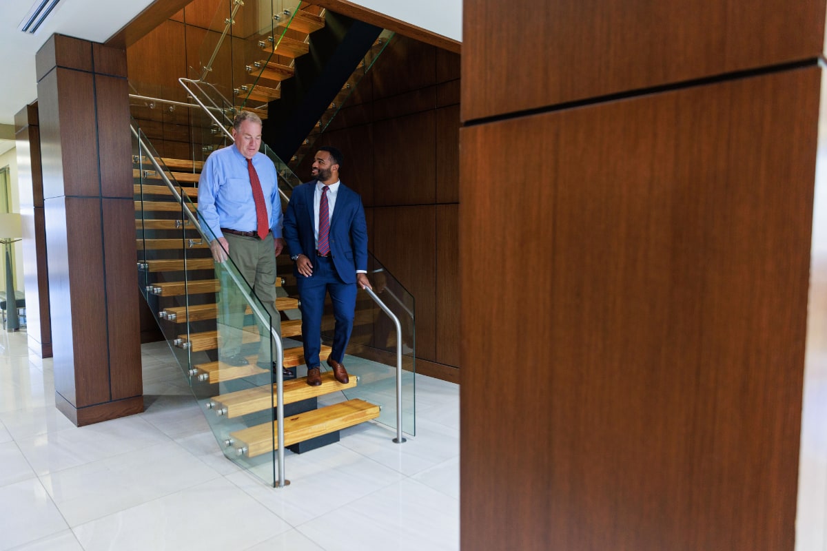 Taylor Porter Attorneys walking down office stairs.