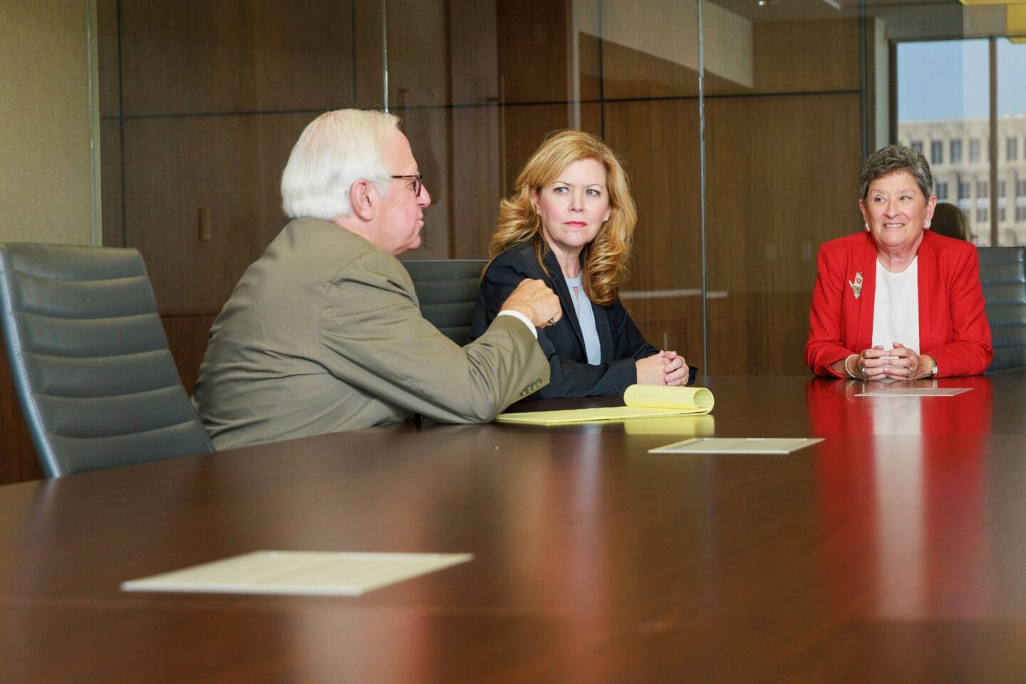 Attorneys meeting at a conference room table.